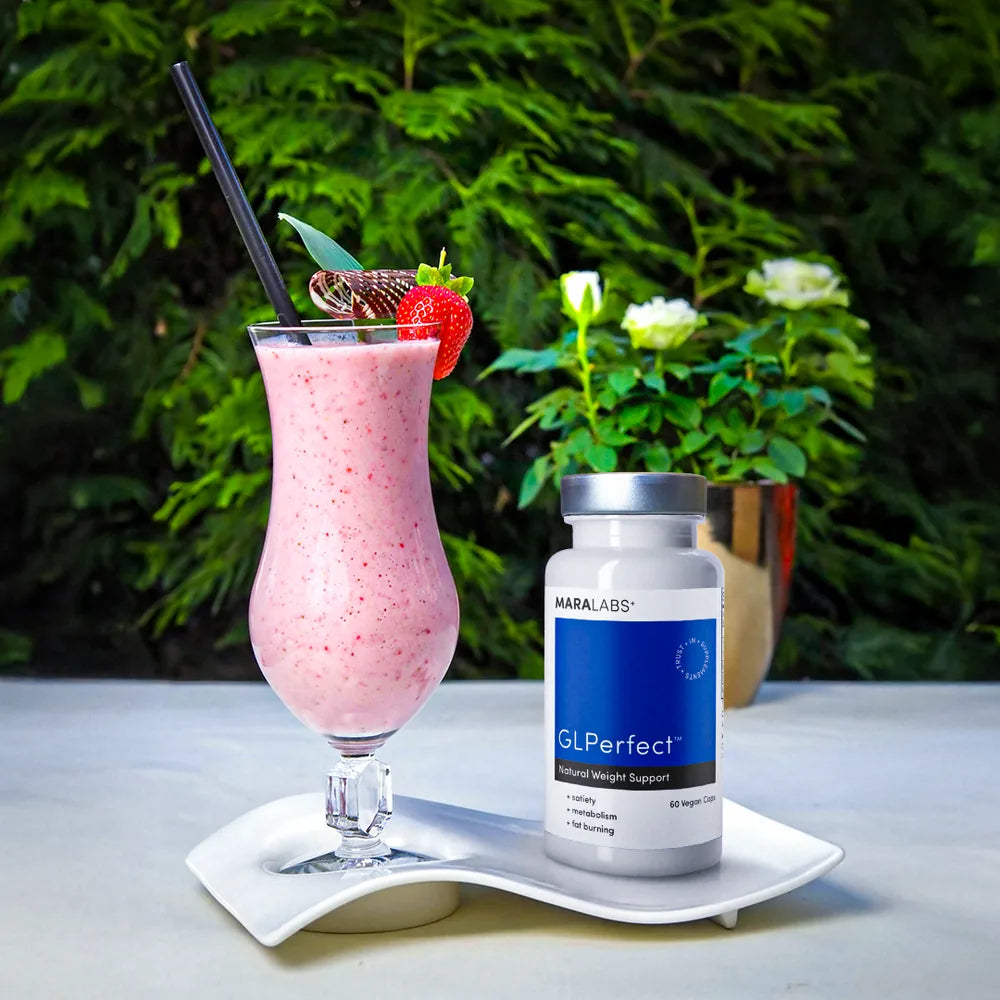 GLPerfect bottle on a patio table next to a strawberry smoothie